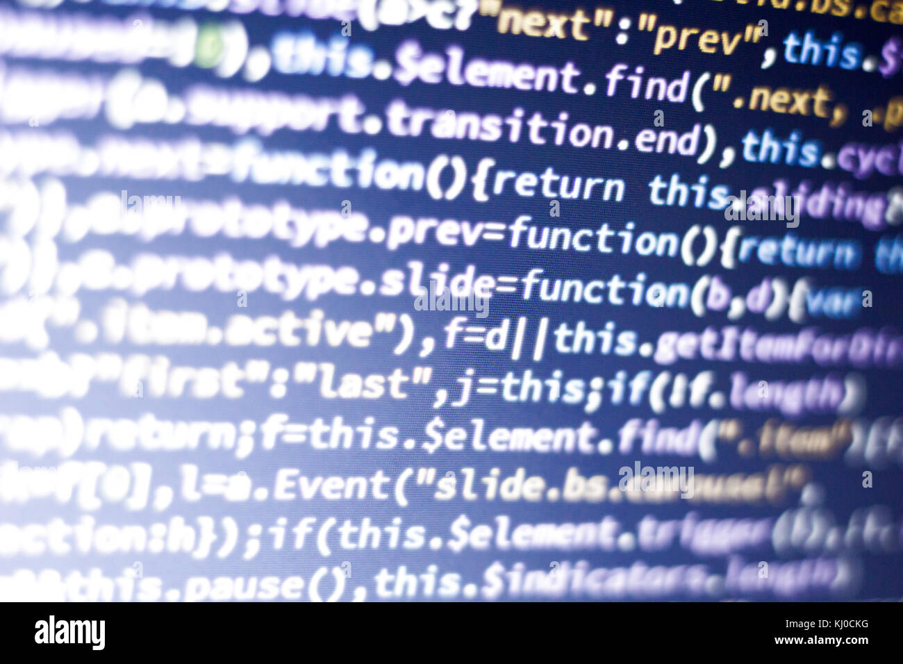 Glowing minificated javascript code. Abstract screen of modern web developer. Hacking computer network. Stock Photo