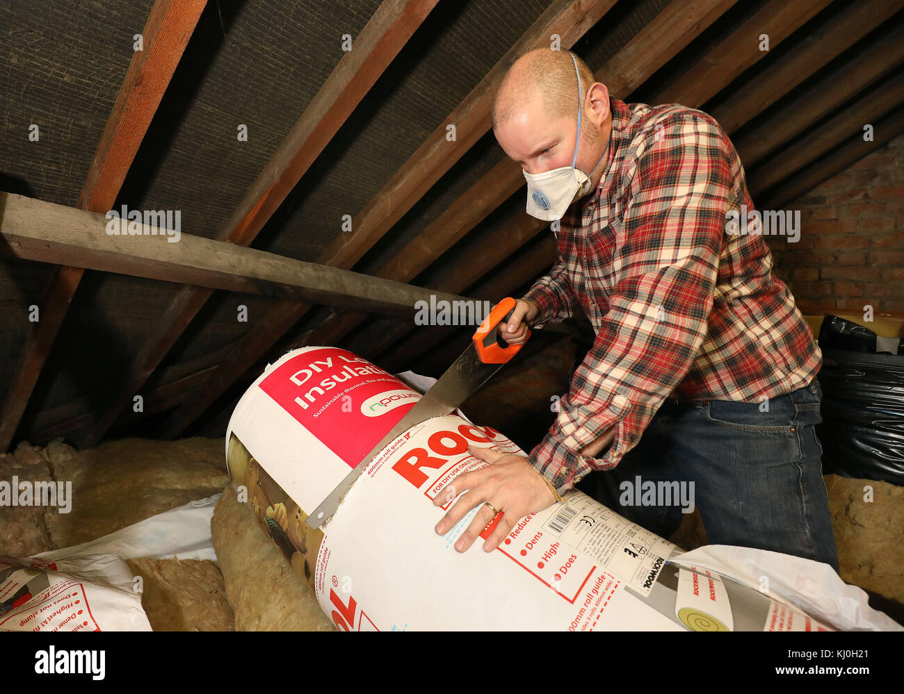 Richard Burr cutting up loft insulation for his DIY feature column ...