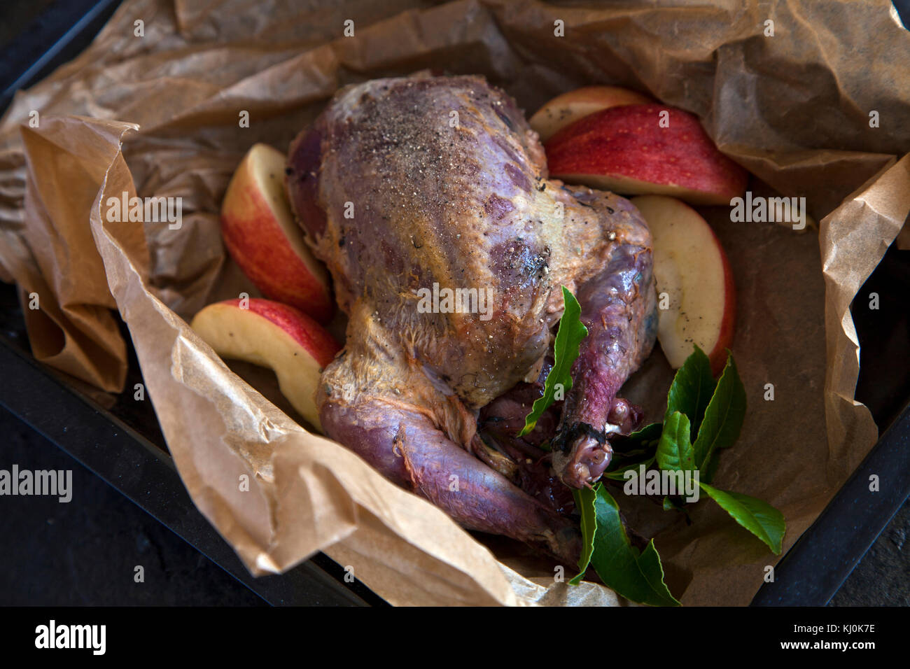 Pheasant oven ready in cooking parchment Stock Photo