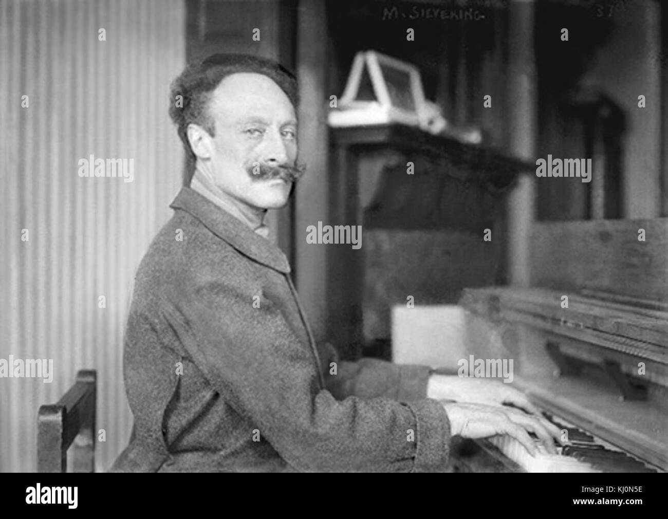 Martinus Sieveking on his oversize piano Stock Photo