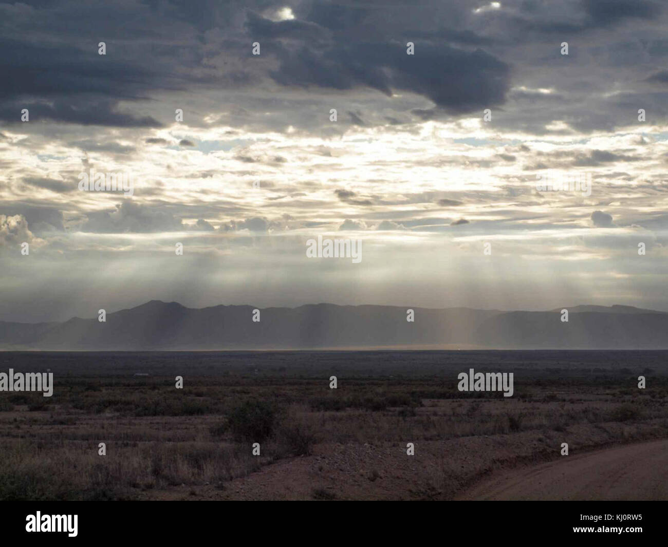 Image of the Sun shining through clouds Stock Photo - Alamy