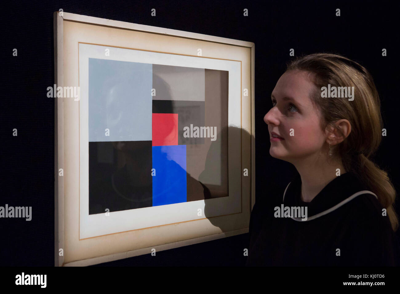A member of staff looks at '1936 (gouache)' by Ben Nicholson (est. &pound;150,000 - 200,000) which forms part of Bonhams' forthcoming Modern British and Irish Art Sale in London. Stock Photo