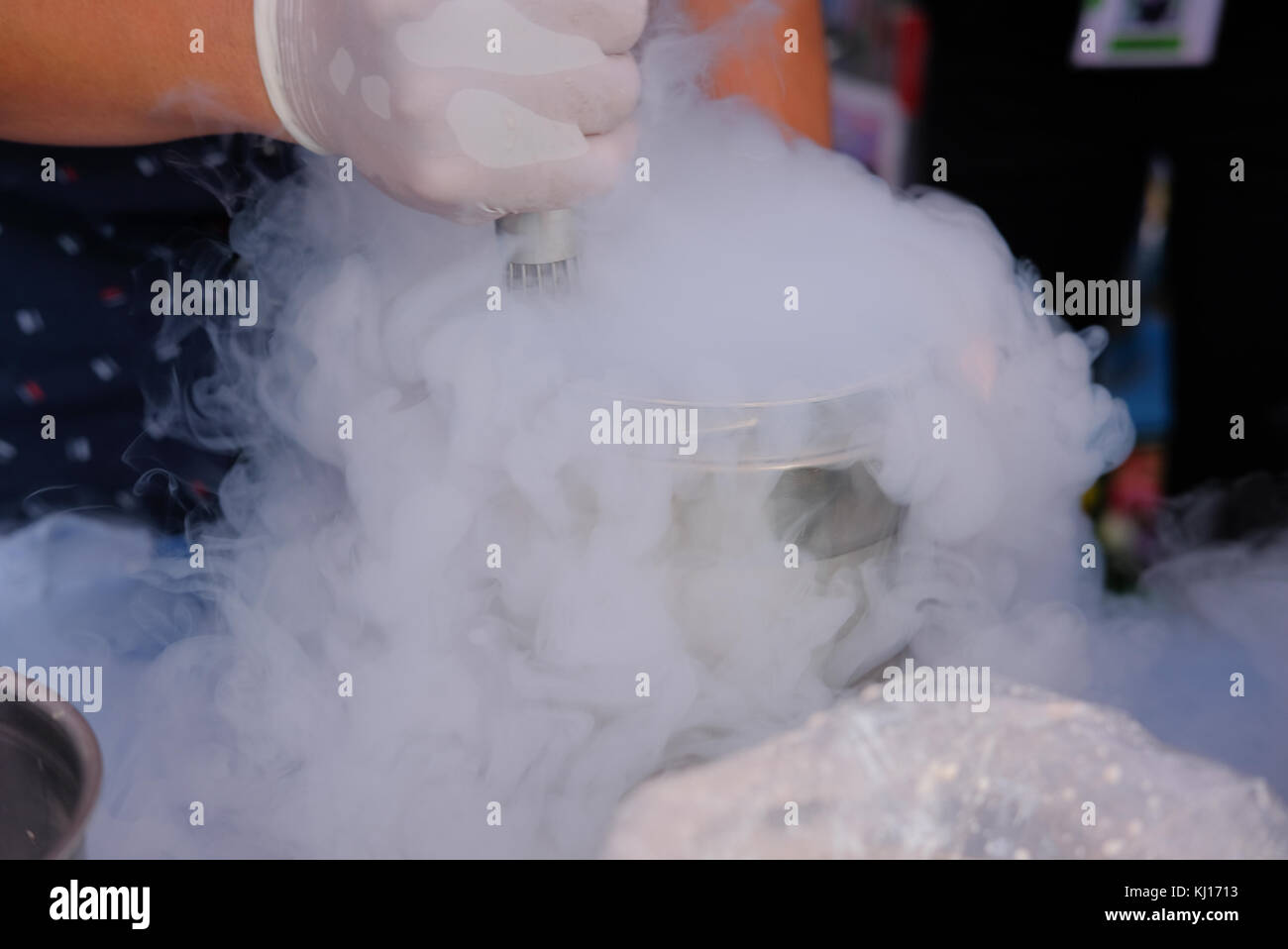 chef making cryogenic ice cream with liquid nitrogen. cooking show Stock Photo