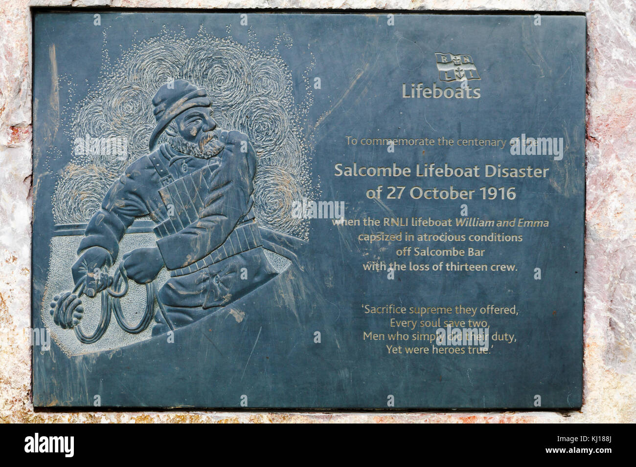 Carved slate commemorative plaque of the centenary of the 1916 Salcombe Lifeboat Disaster on the cliff of Sharp Tor Stock Photo