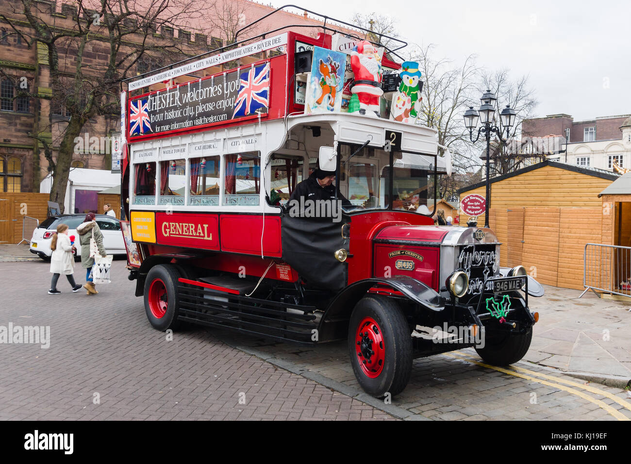 Vintage open top tourist bus decorated with Christmas decorations in the historic city of Chester Stock Photo
