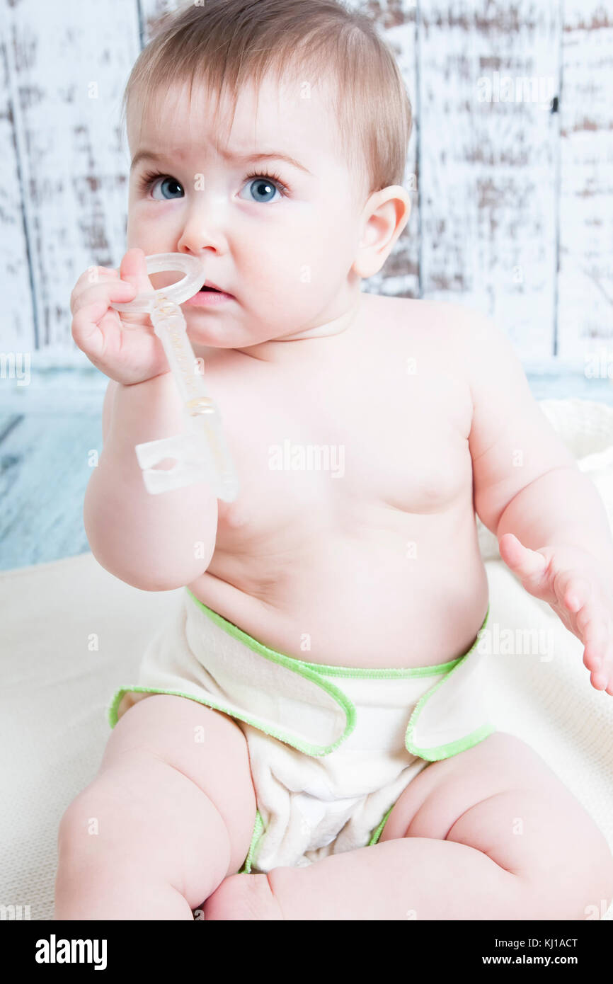 A small child in natural tissue diapers, ecofriendly cotton diapers
