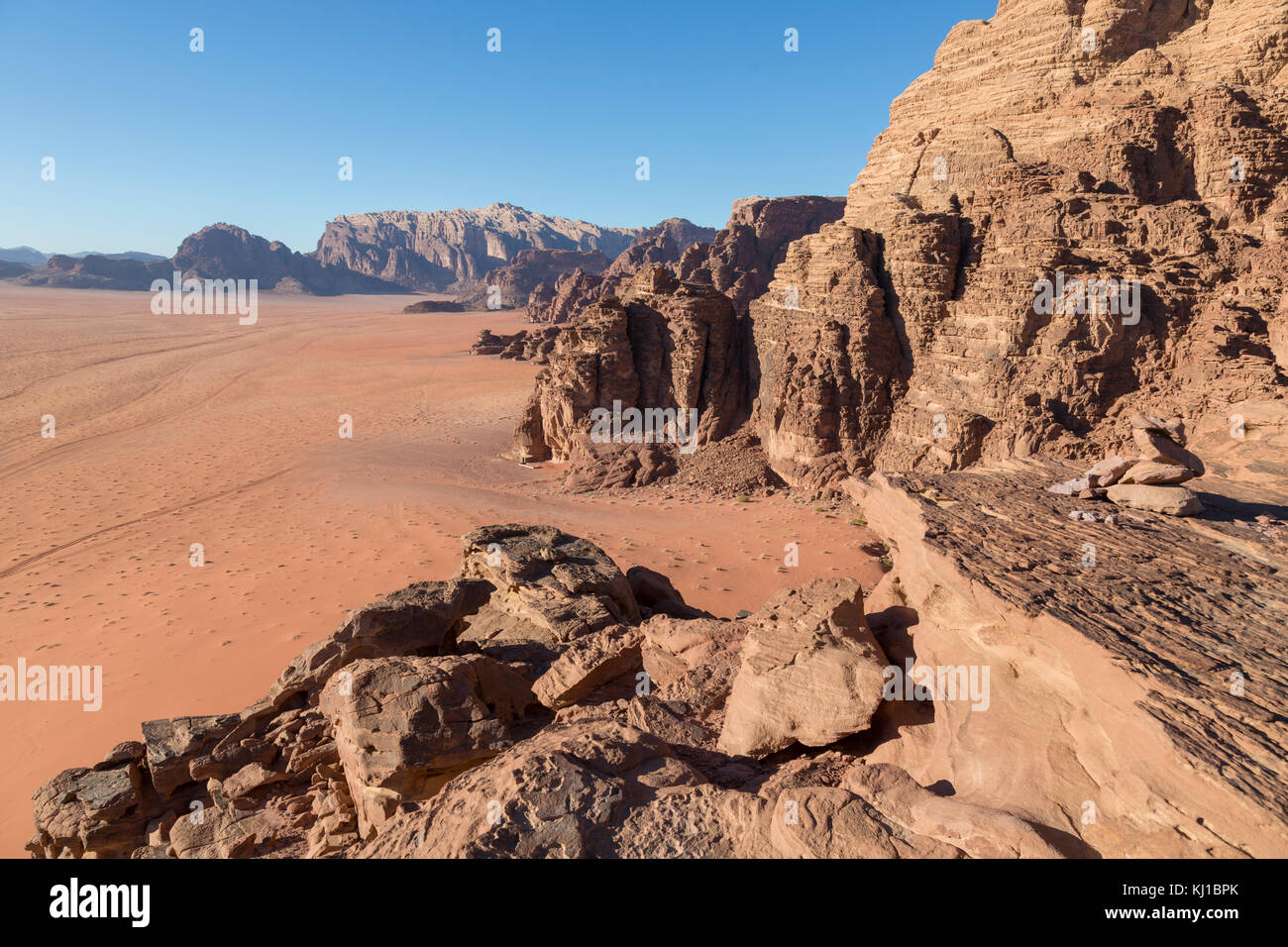 Reddish sand and rock landscapes in the desert of Wadi Rum, southern ...
