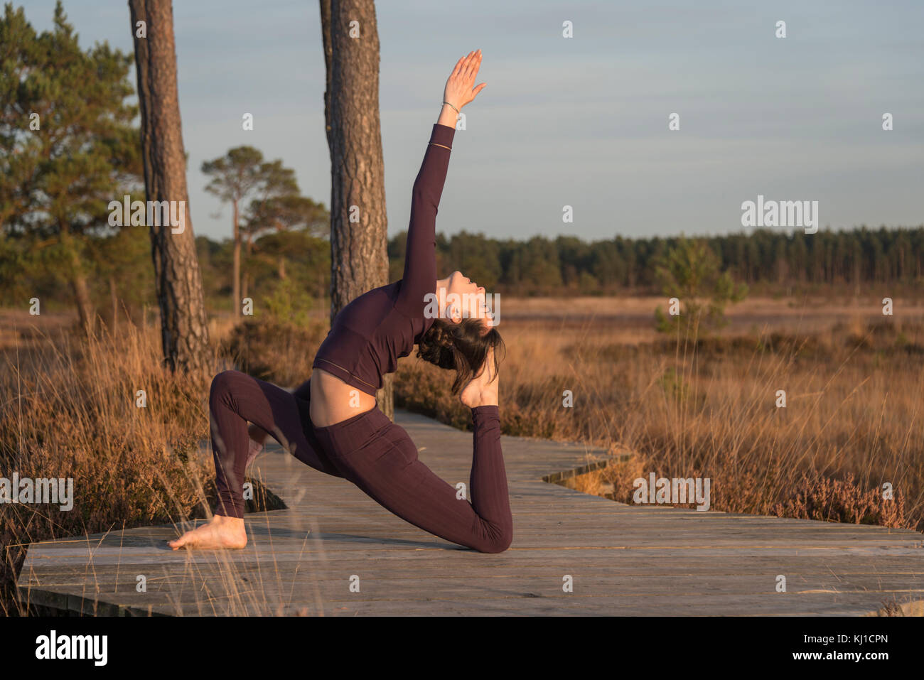 woman doing yoga, king pigeon pose Stock Photo