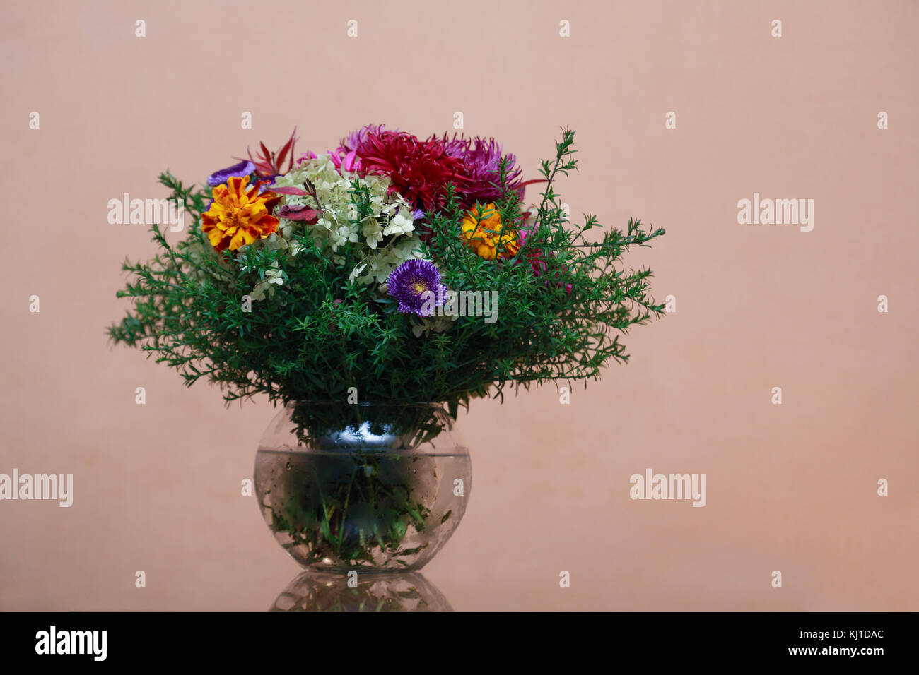 Glass Vase With Fresh Flower Bouquet On Cool Violet Background
