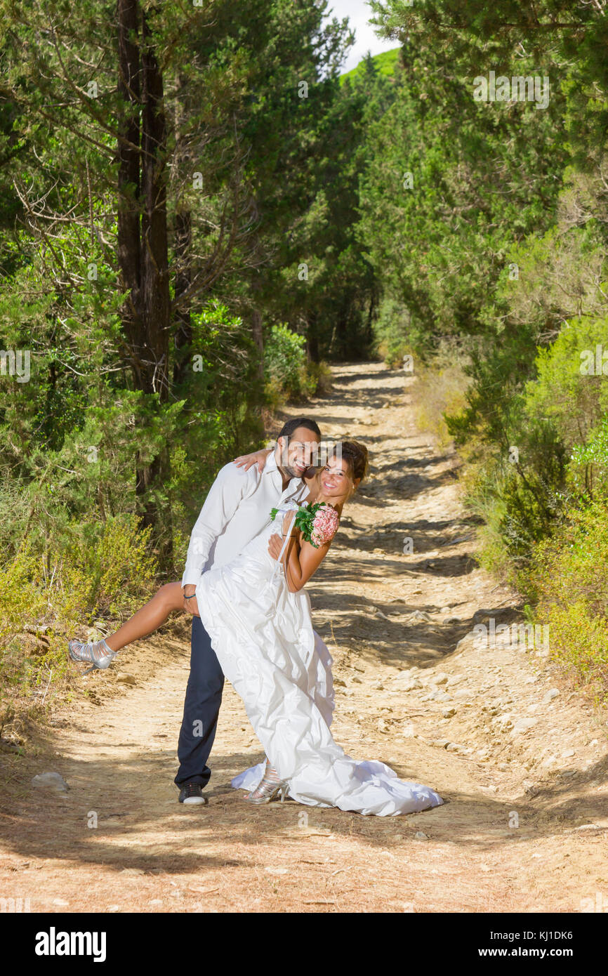 portrait of a bride and groom in a forest for the next day shooting ...