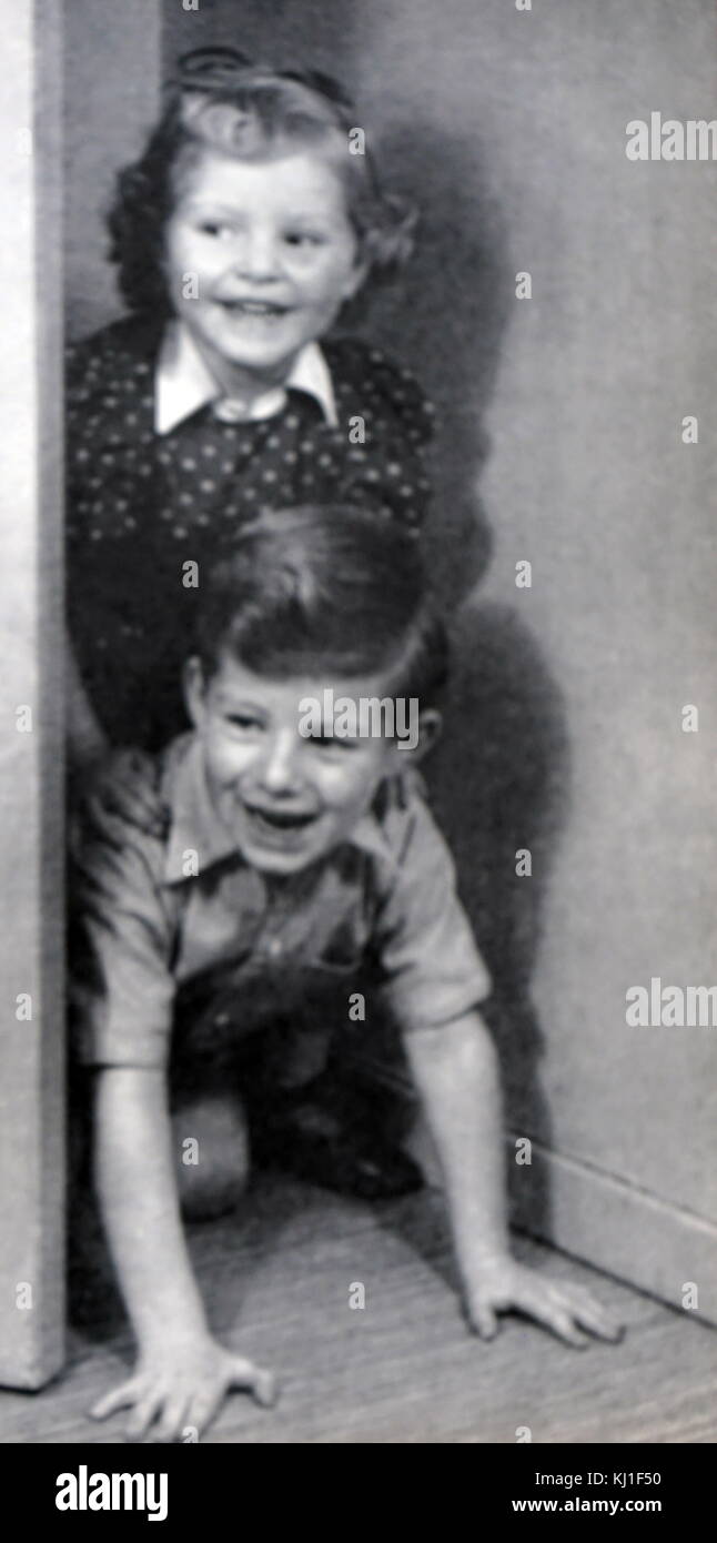 Two young children playing at home circa 1948 Stock Photo