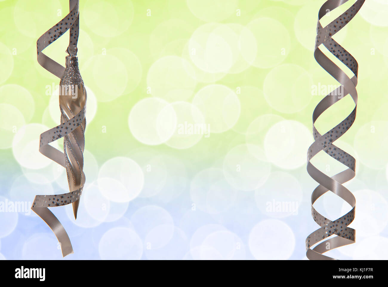 Green christmas background with a silver ribbon Stock Photo - Alamy