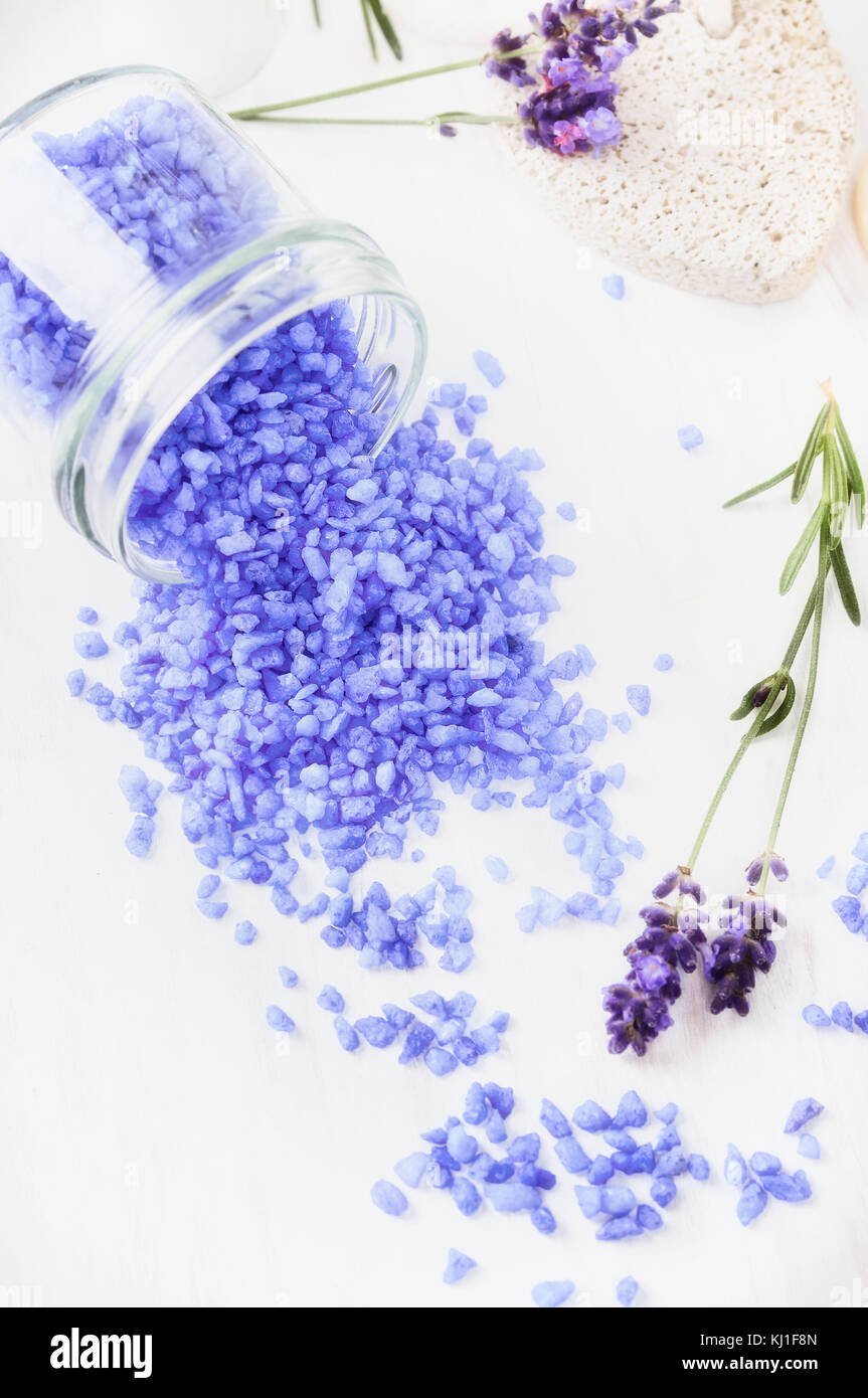 lavender oil and salt in glass bottle on background of dry lavender flowers.  Natural cosmetic Stock Photo by serenkonata