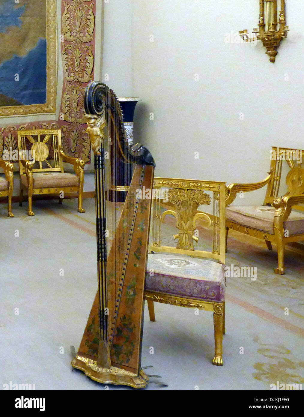 Drawing room of Tsar Nicholas II at the Winter Palace, St Petersburg, Russia. the Empire-style interior, of the drawing-room includes a part of a large furniture-set designed by the architect Luigi Rusca. The furniture with tapestry upholstery, commissioned by the Head of the Court Office, Dmitry Guryev, was made in 1805 — 1806 at the Imperial Tapestry Works. Stock Photo
