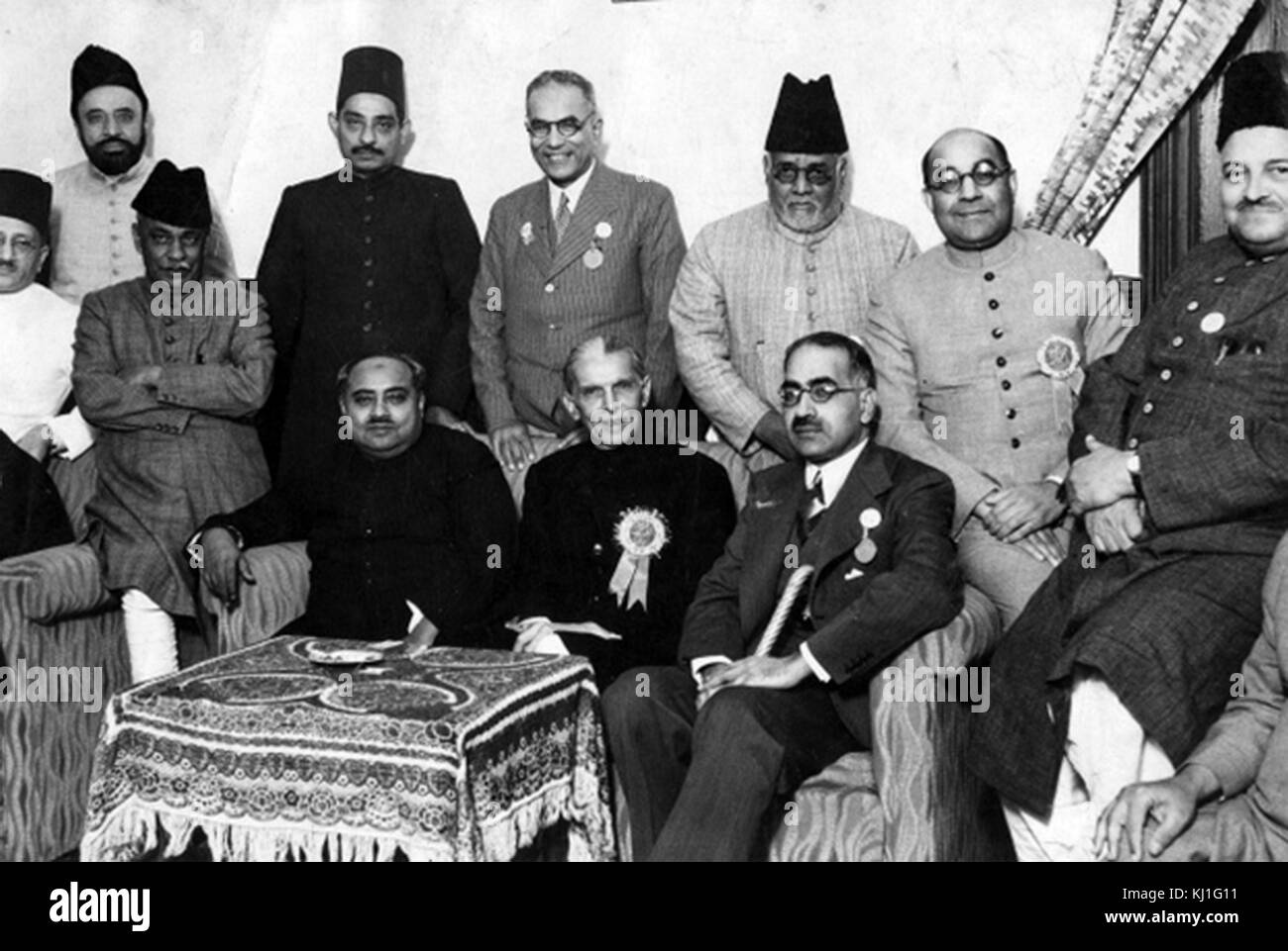 Pakistani leaders 1947: Mohammed Ali Jinnah (center); Sir Sikander Hayat Khan (right), Sir Nizam-ud-Din (left) with Liaquat Ali Khan (back row, second from right). Stock Photo