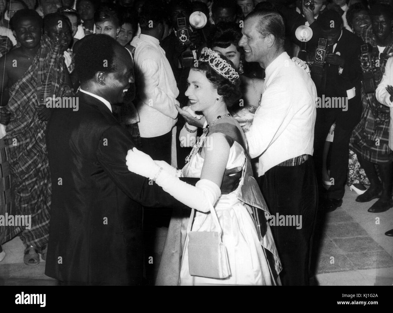 Queen Elizabeth II of Great Britain dances with President Kwame Nkrumah of Ghana, during her visit to Accra, Ghana, in 1961 Stock Photo