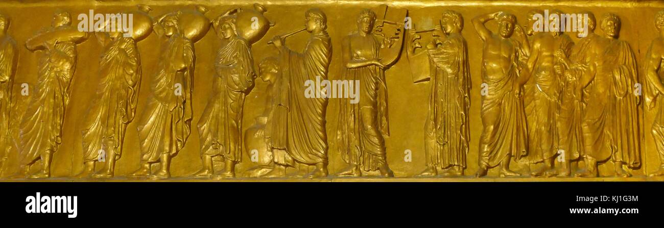 Gilded 19th century replica of the Parthenon frieze. The Frieze was a relief in pentelic marble, created to adorn the upper part of the Parthenon’s naos. It was sculpted between c. 443 and 438 BC, most likely under the direction of Phidias Stock Photo