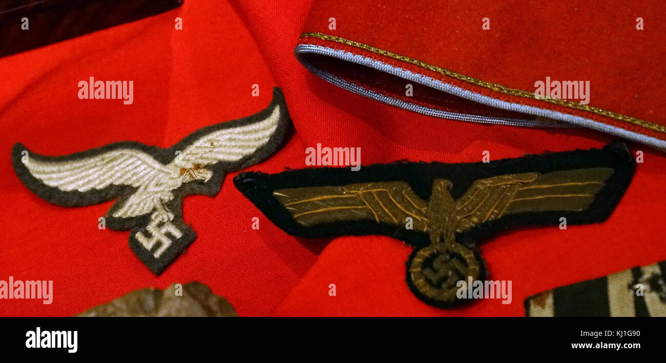 German Nazi armband and insignia, captured during the liberation of France  in World war two Stock Photo - Alamy