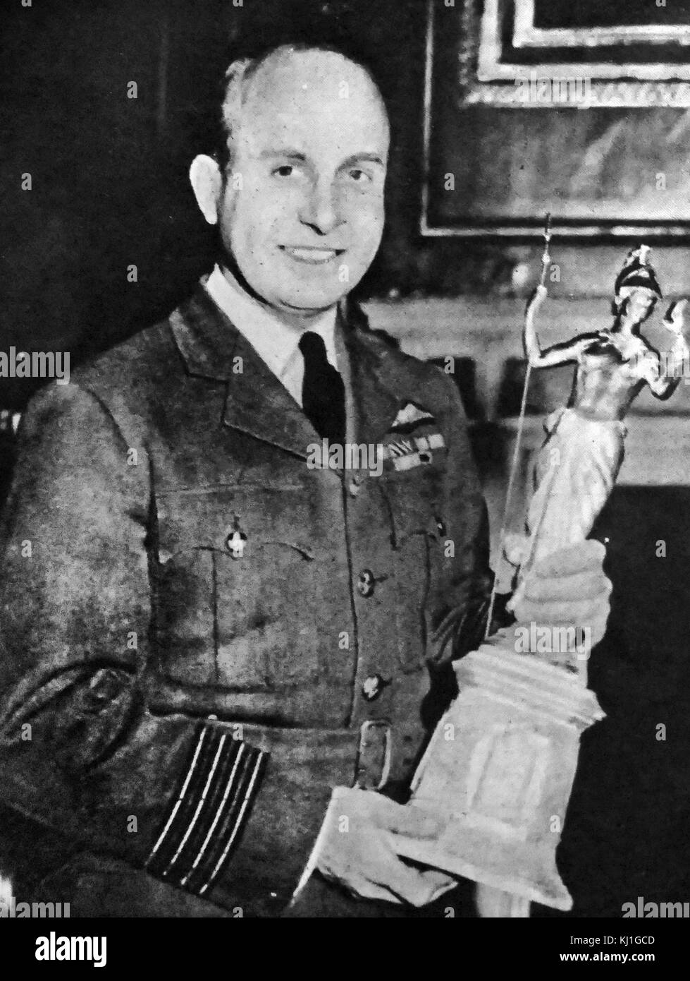 Air Commodore Edward 'Teddy' Mortlock Donaldson (1912 – 1992). Royal Air Force (RAF) flying ace of the Second World War, and a former holder of the airspeed world record. seen holding the Britannia Trophy in 1946 Stock Photo