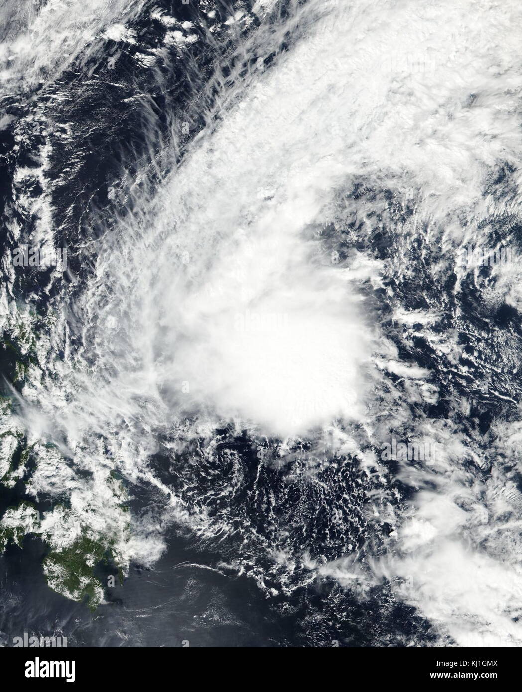 Tropical Depression Bising near peak strength east of Philippines on February 5, 2017. Early on February 12, PAGASA reported that a low-pressure area located about 140 km (87 mi) to the east of Surigao City in the Philippines had intensified into a tropical depression. During that day the depression gradually moved towards the west with its peak wind speeds estimated at 45 km/h (30 mph). Stock Photo