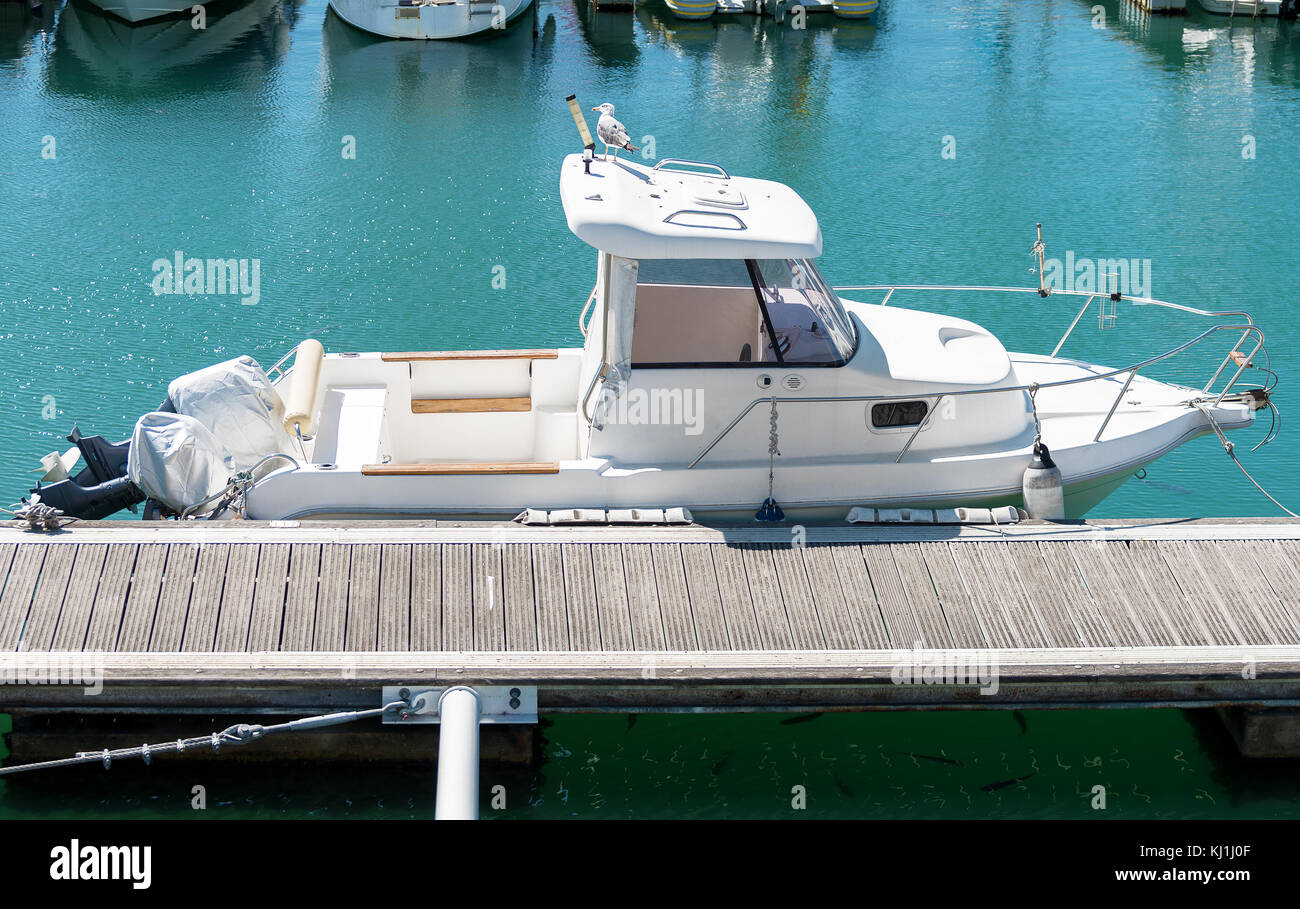 Motor boat moored at the dock Stock Photo - Alamy