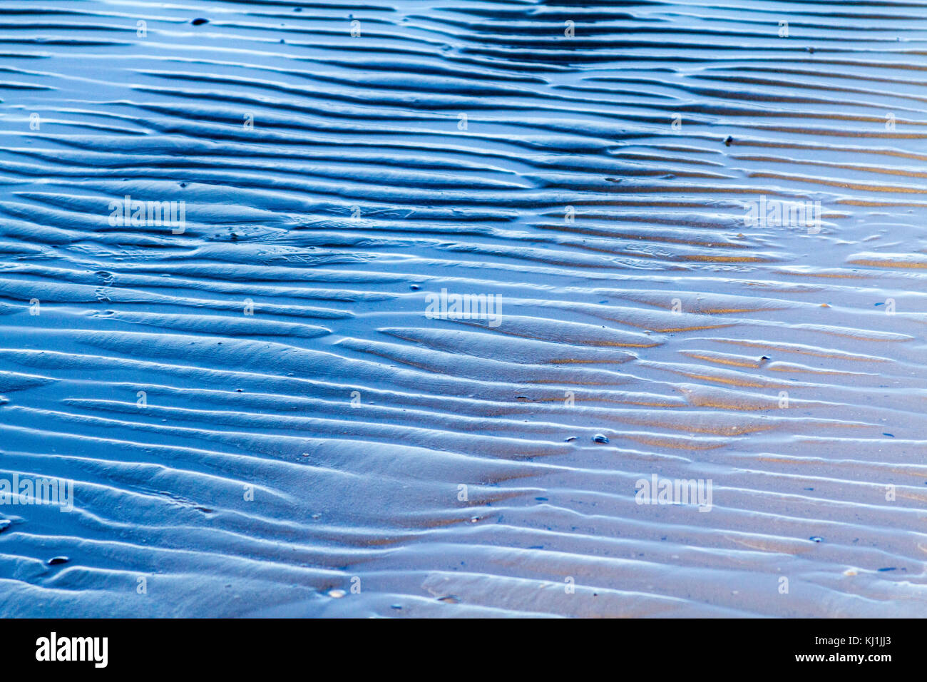 Ripples in the sand on a beach Stock Photo