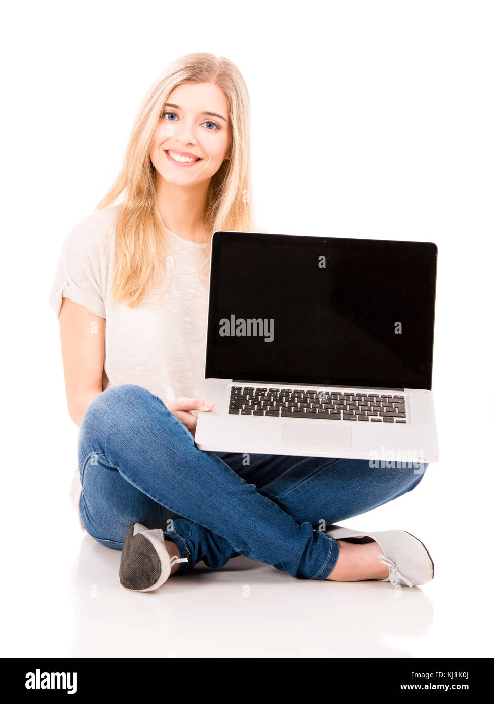 Beautiful and happy woman working with a laptop, isolated over white ...