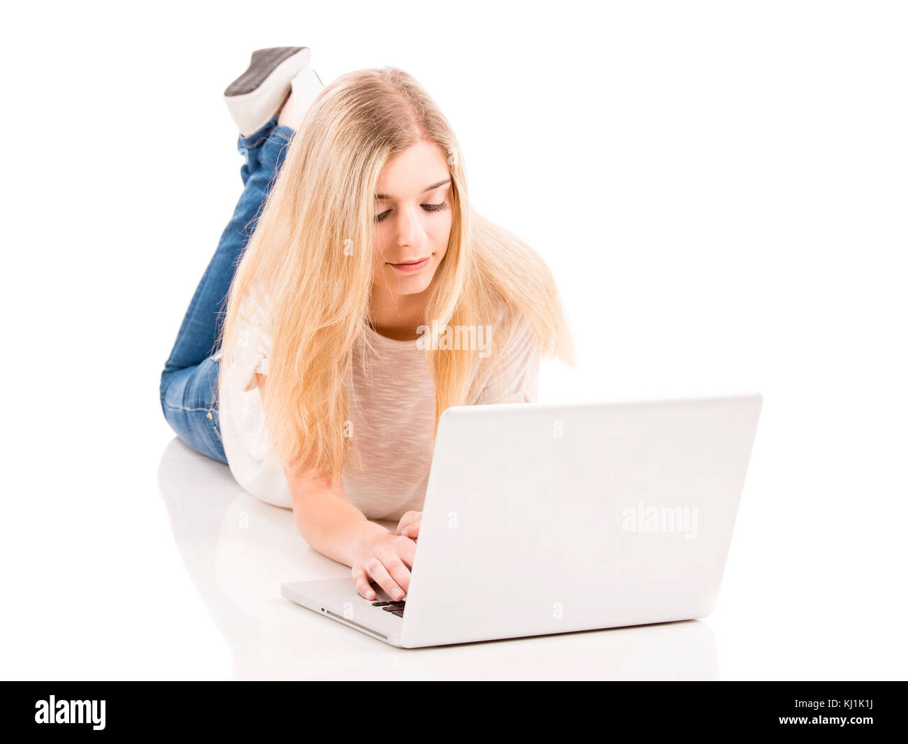 Beautiful woman working with a laptop, isolated over white background ...
