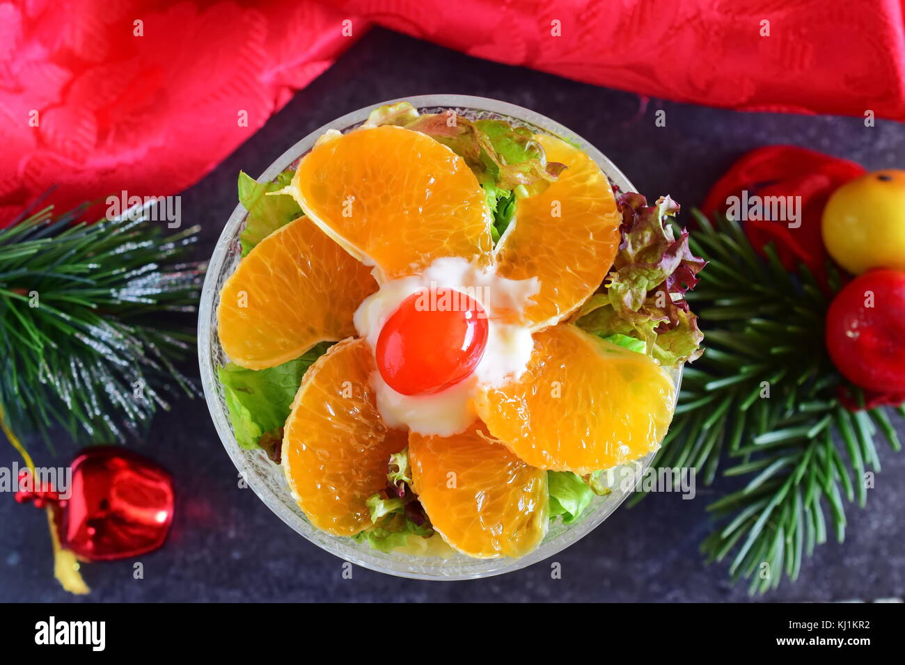 Fresh salad with chicken, banana, cheese, salad leaves,yogurt dressing. Christmas decoration, Holidays New year Stock Photo