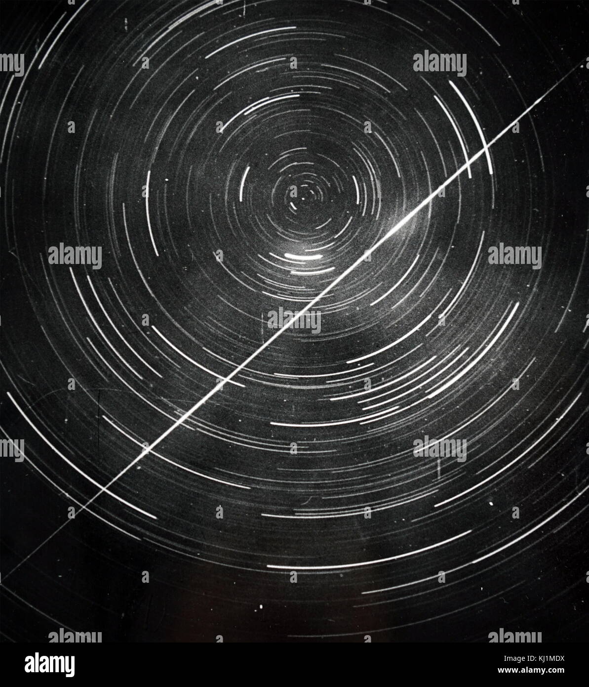 Long exposure photograph of circumpolar stars with a meteor trail. Dated 19th Century Stock Photo