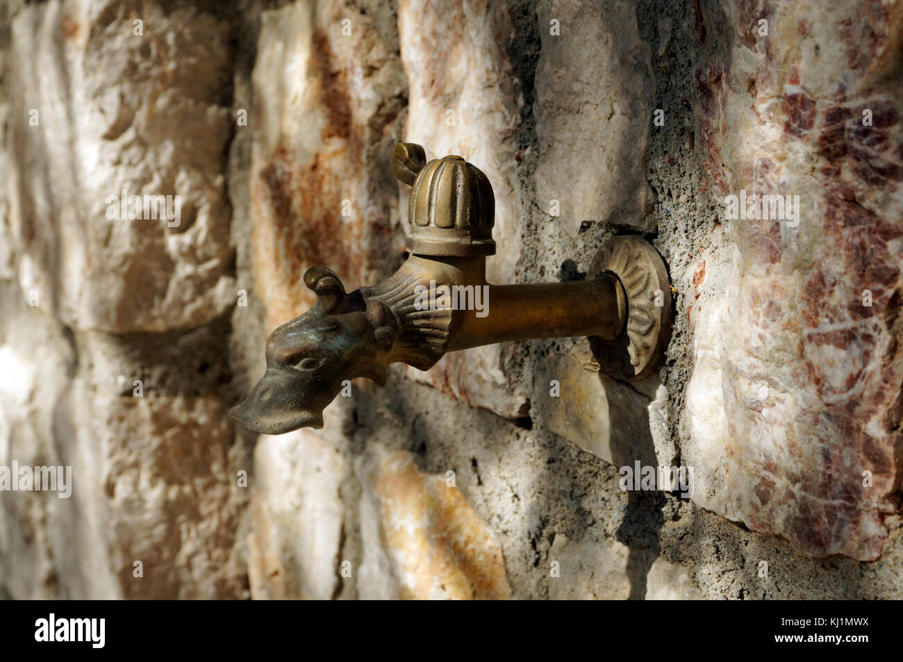 Tap shaped like a fishes head, Archangelos, Rhodes, Dodecanese islands, Greece. Stock Photo