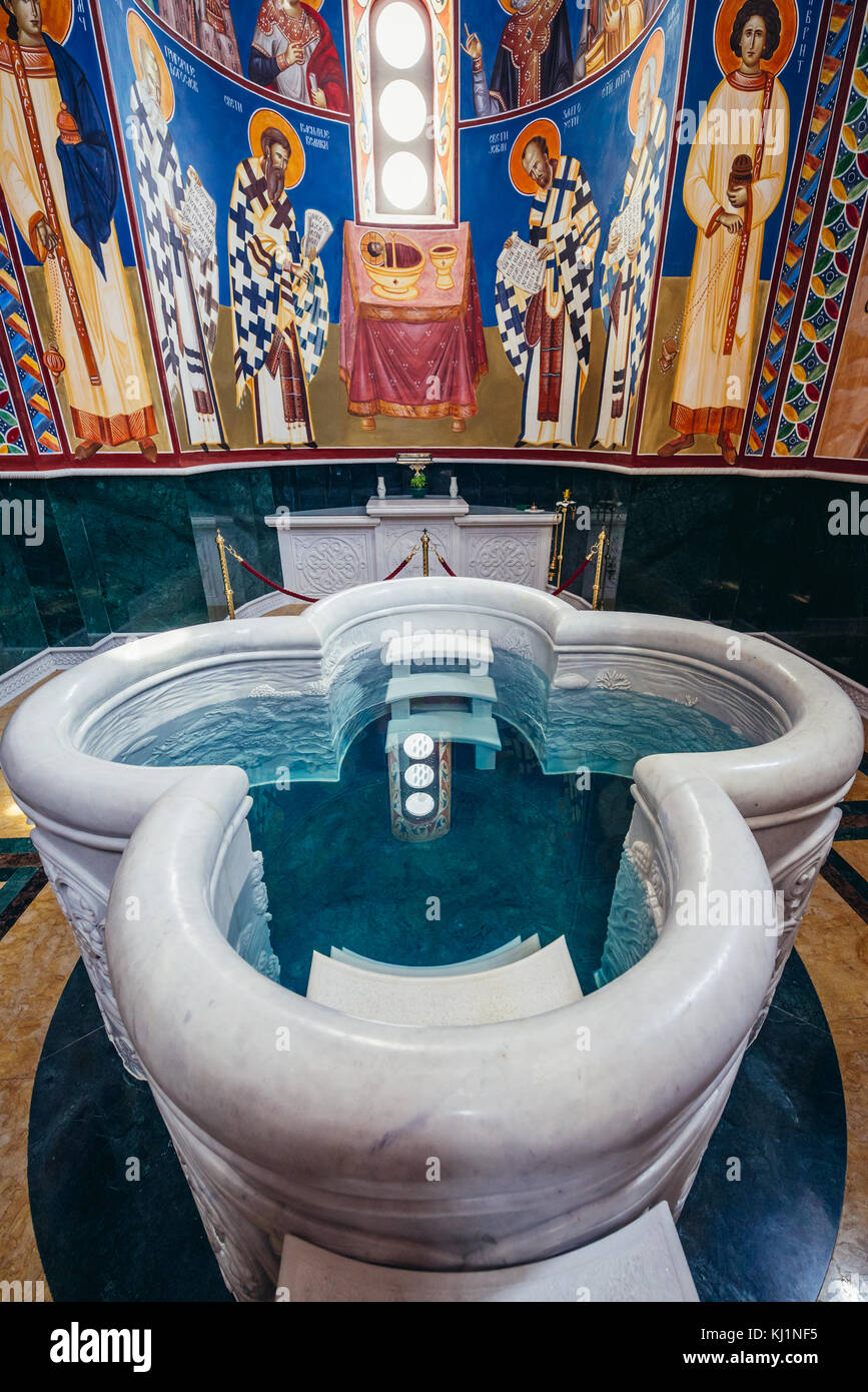 Large baptismal basin in Saint Jovan Vladimir Orthodox temple in Bar coastal town in southern Montenegro Stock Photo