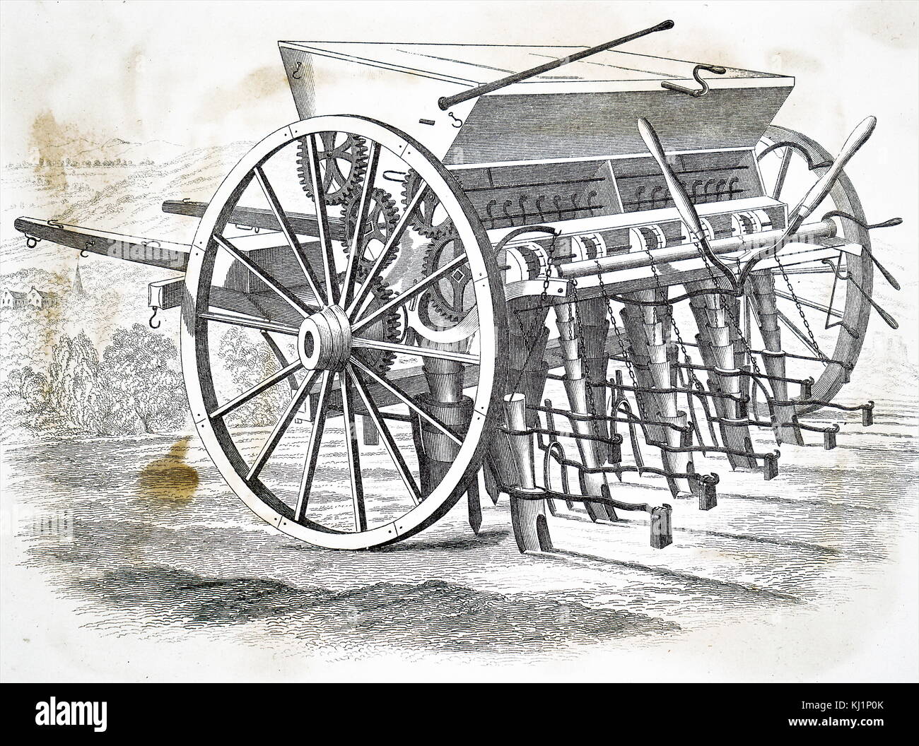 Engraving depicting Garrett's seed drill for sowing turnips and distributing bone meal at the same time. Dated 19th Century Stock Photo