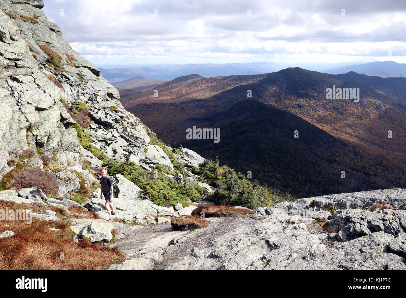 Man hiking the Long Trail near the summit of Camel's Hump, VT, USA Stock Photo