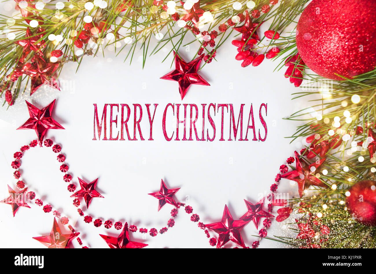 Merry Christmas card with red decorations and fir tree Stock Photo