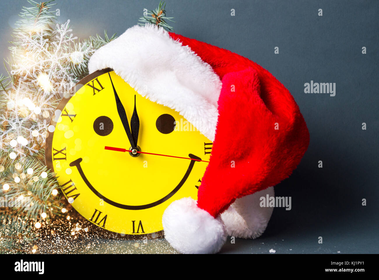 Smiley face clock and Sand hat with Christmas decorations Stock Photo