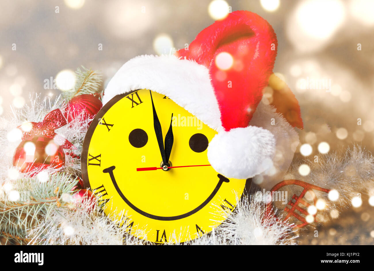 Smiley face clock and Sand hat with Christmas decorations Stock Photo