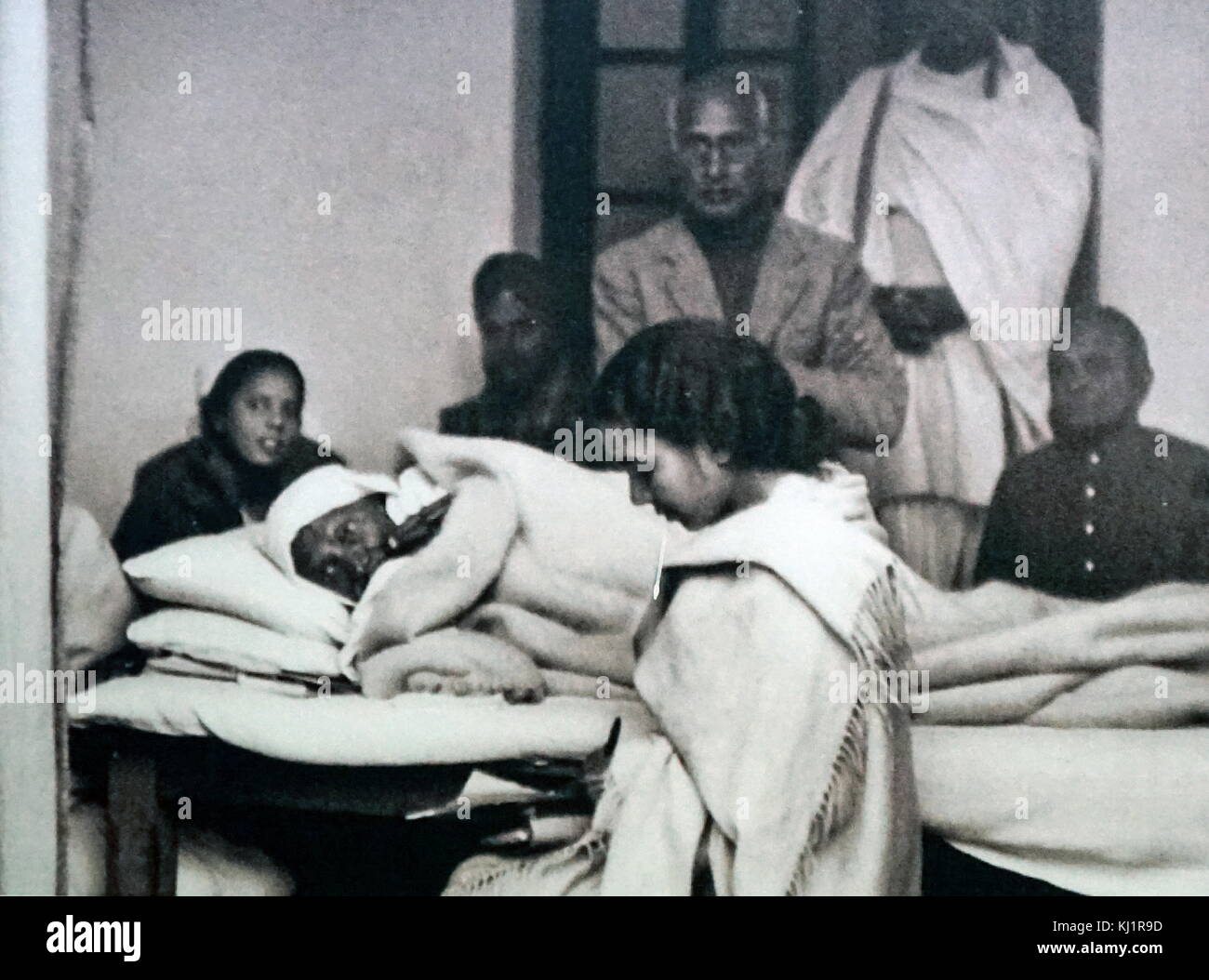 hunger strike by Mohandas Karamchand Gandhi (1869 – 1948), Gandhi was the preeminent leader of the Indian independence movement in British-ruled India. At 5:17 pm on 30 January 1948, Gandhi was with his grandnieces in the garden of the former Birla House (now Gandhi Smriti), on his way to address a prayer meeting, when Nathuram Godse fired three bullets from a Beretta 9 mm pistol into his chest at point-blank range Stock Photo