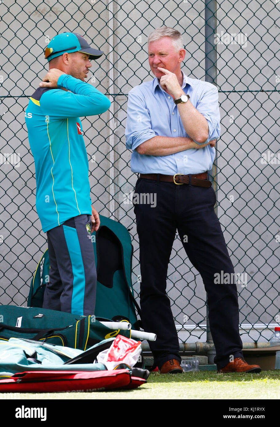 Australia's David Warner clutches his neck during a nets session at The