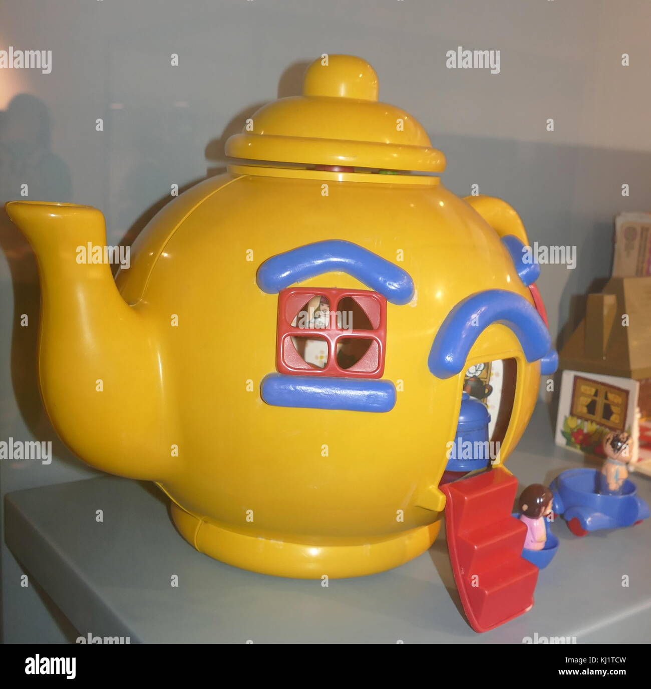 Plastic Teapot Toy House with figures. British 1985 Stock Photo