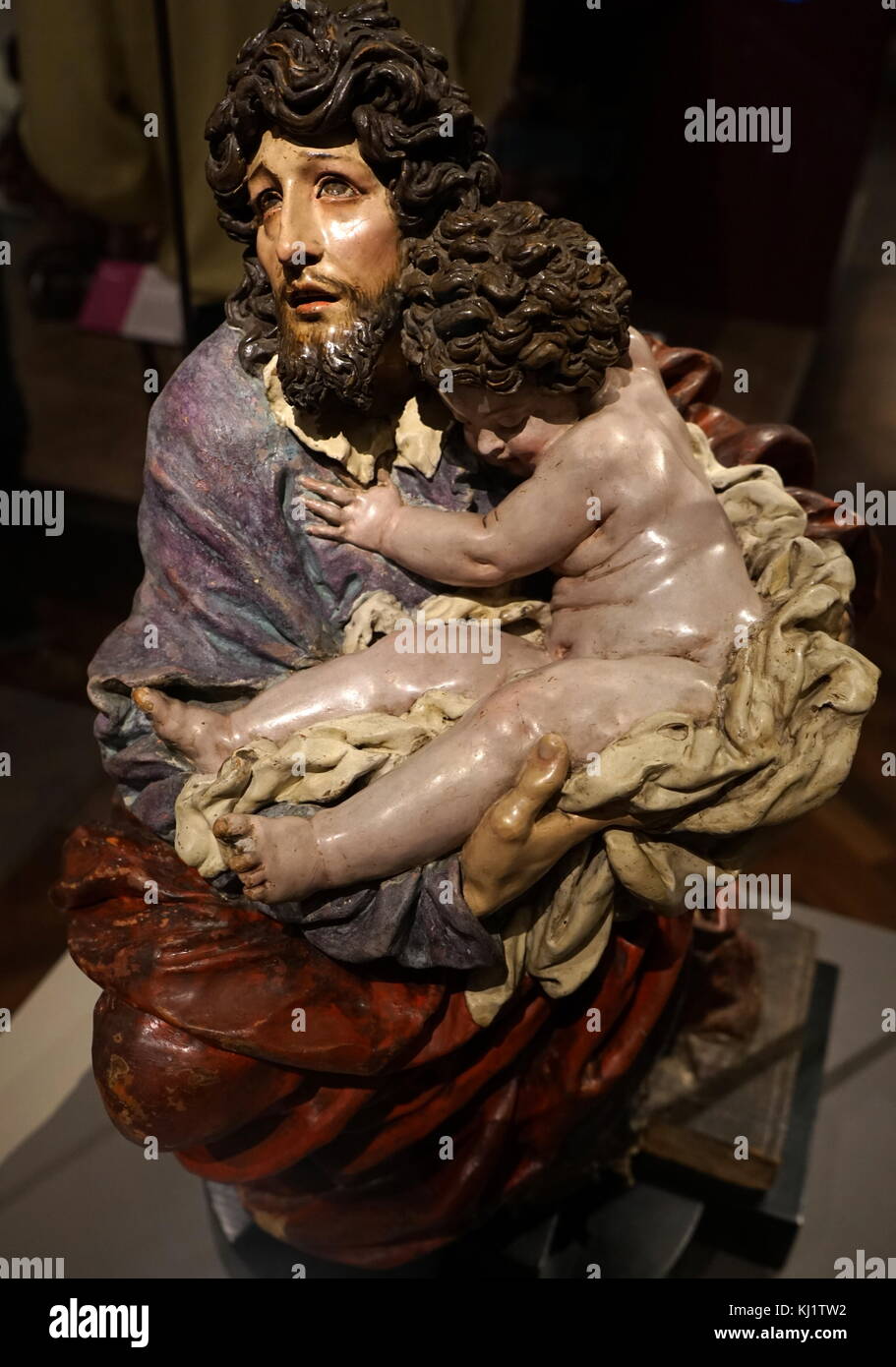 Sculpture titled 'St Joseph with the Christ Child' by Jose Risueño (1665-1721) a Spanish painter and sculptor of the Baroque period. Dated 18th Century Stock Photo