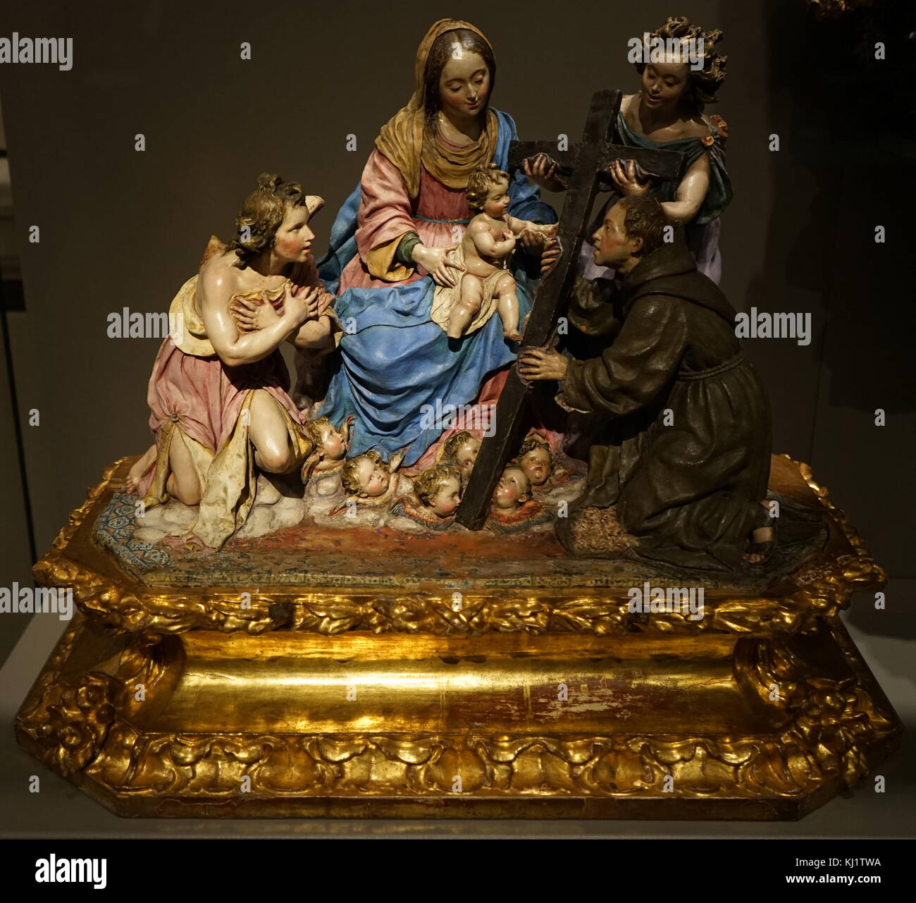 Sculpture titled 'The Virgin and Child with St Diego of Alcalá' by Luisa Roldán (1652-1706) a Spanish sculptor of the Baroque period. Dated 17th Century Stock Photo