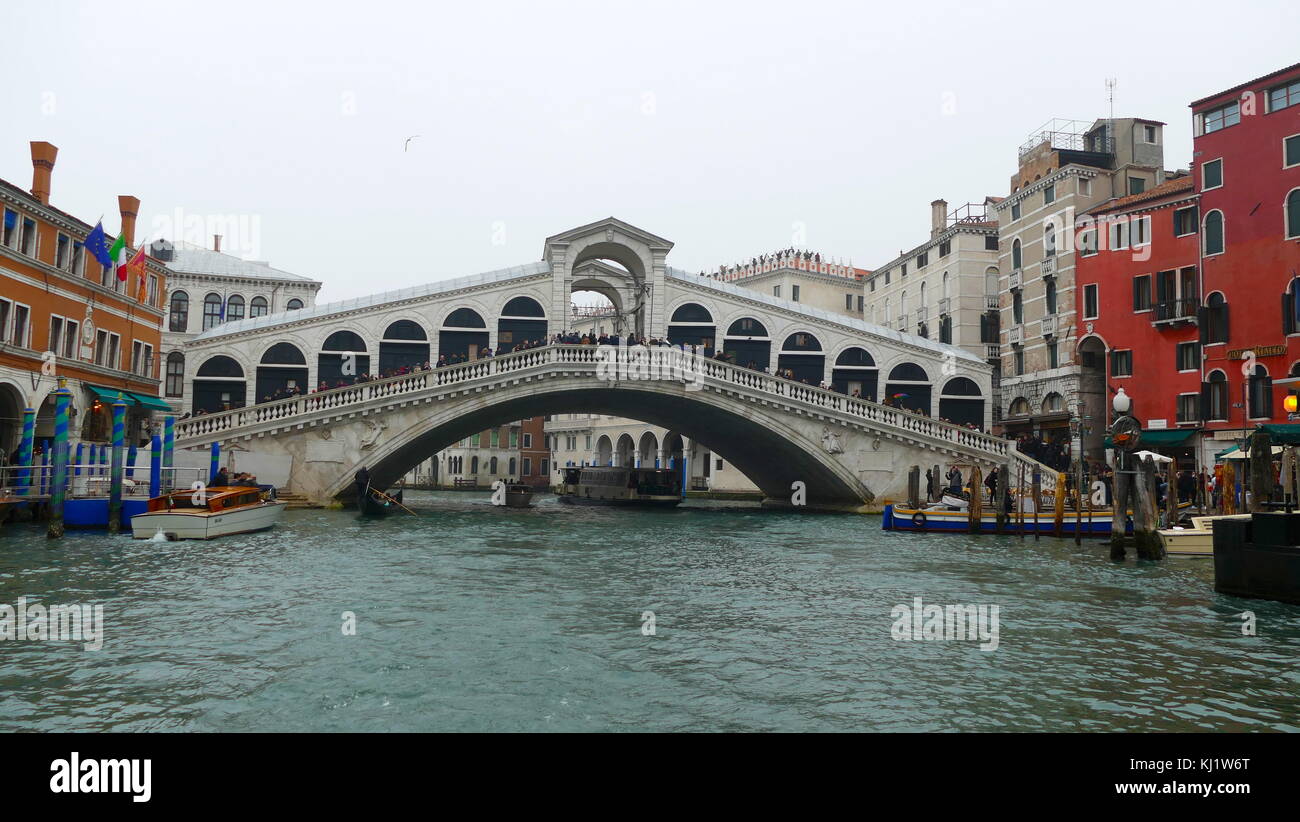 The Rialto Bridge (Ponte di Rialto), spanning the Grand Canal in Venice, Italy. It is the oldest bridge across the canal. The present stone bridge was designed by Antonio da Ponte, was finally completed in 1591. Stock Photo