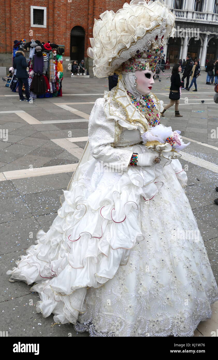 Costumed attendee at the Venice Carnival (Carnevale di Venezia), an annual festival held in Venice, Italy. Started to recall a victory of the 'Serenissima Repubblica' against the Patriarch of Aquileia, in the year 1162. In the honour of this victory, the people started to dance and gather in San Marco Square. Stock Photo