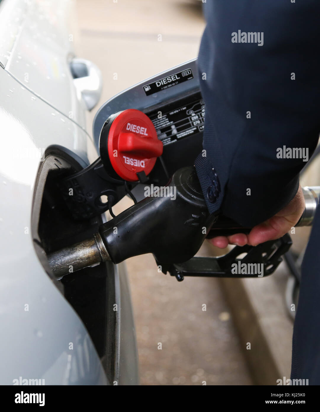 North London. UK 21 Nov 2017 - A driver filling his car with motor fuel pump in a North London petrol station forecourt as Britain's Chancellor of the Exchequer Philip Hammond is expected to announce an increase in motor fuel tax in his autumn budget on Wednesday, 22 November 2017. Stock Photo