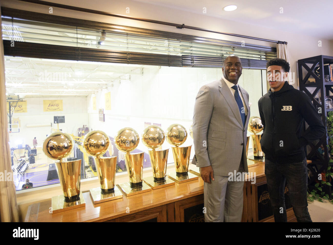El Segundo, California, USA. 23rd June, 2017. Lakers draft pick Lonzo Ball  stands for a photograph with Magic Johnson and championship trophies at the  Lakers' Practice Facility on Friday, June 23, 2017