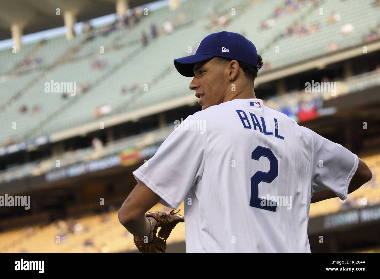 El Segundo, California, USA. 23rd June, 2017. Dodgers pitcher Kenley Jansen,  wearing a Lakers jersey, shares a moment with Lakers draft pick Lonzo Ball  after he threw out the first pitch at