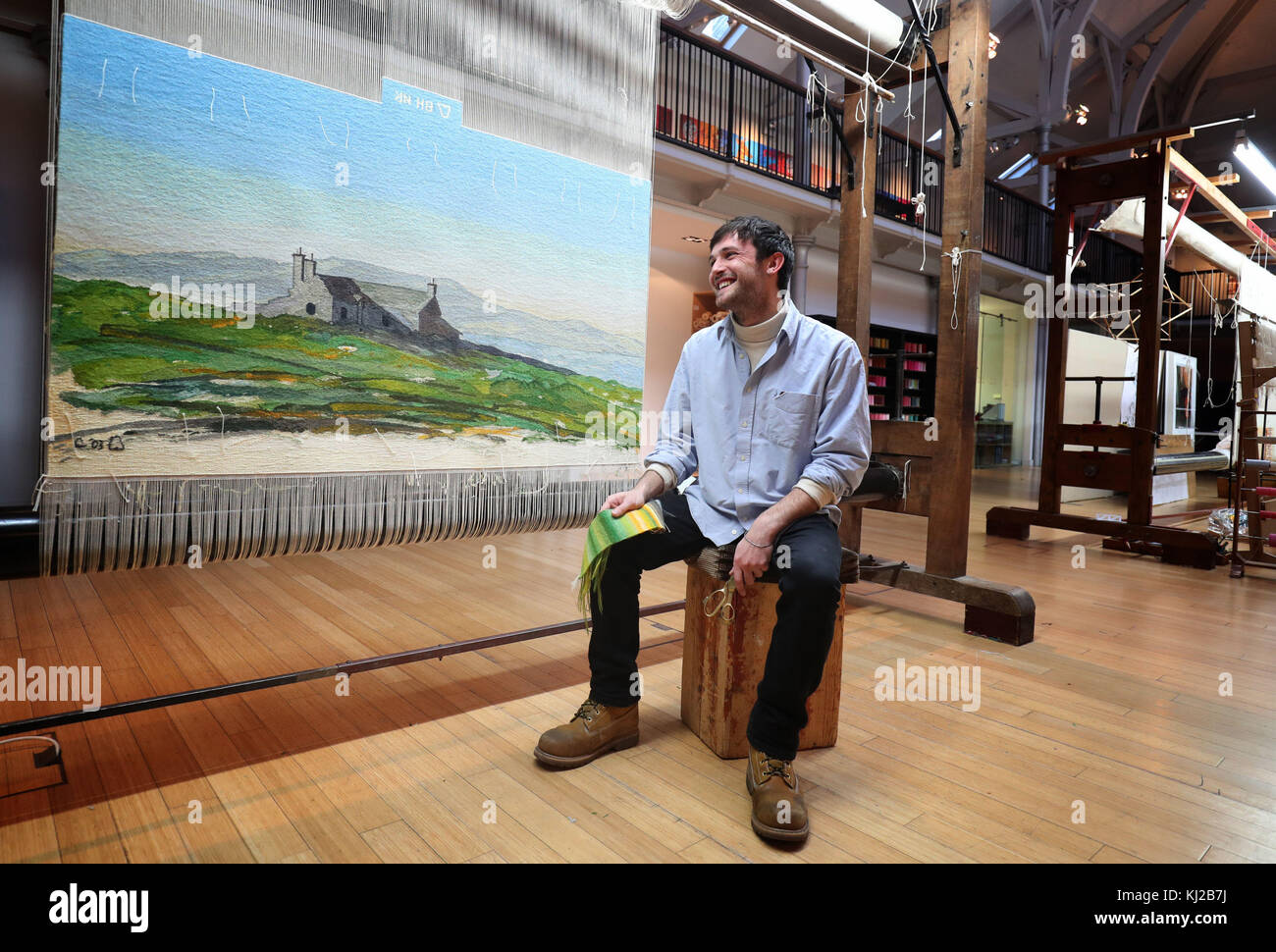 Apprentice weaver Ben Hymers, who has created a tapestry from a