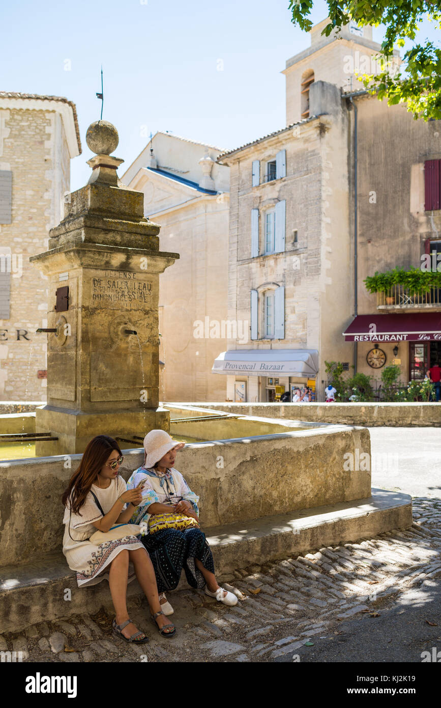 asian girls in the street of the village Gordes, Provence, France, Europe. Stock Photo