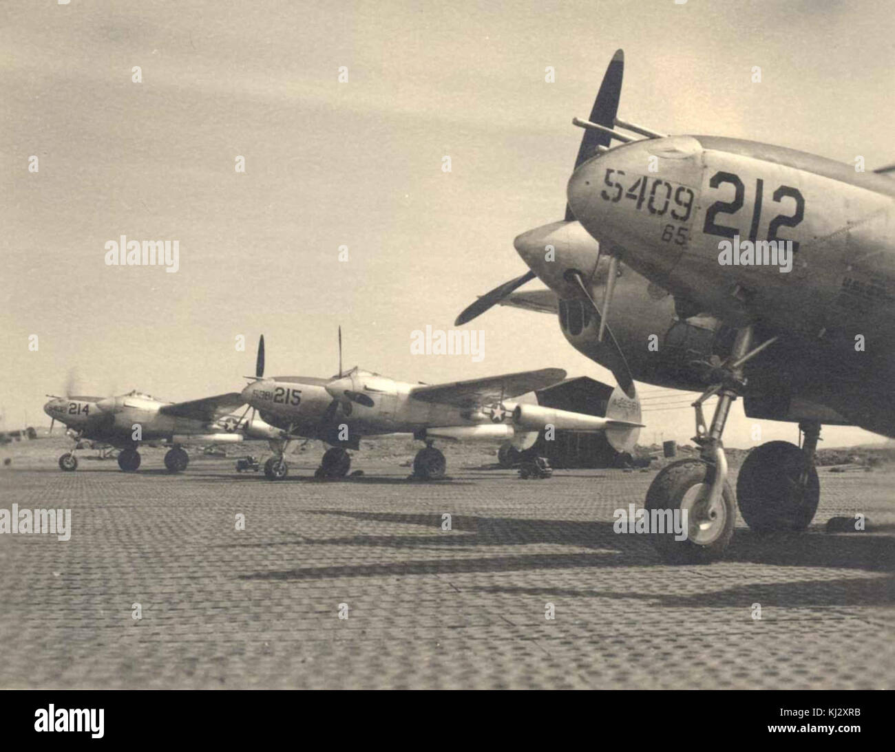 Several Lockheed P-38 Lightning aircraft from world war 2 on runway Stock Photo